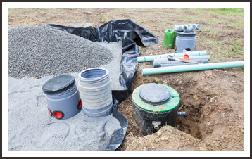 Sand and gravel on septic tank excavation