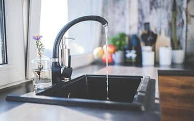 open faucet in kitchen sink