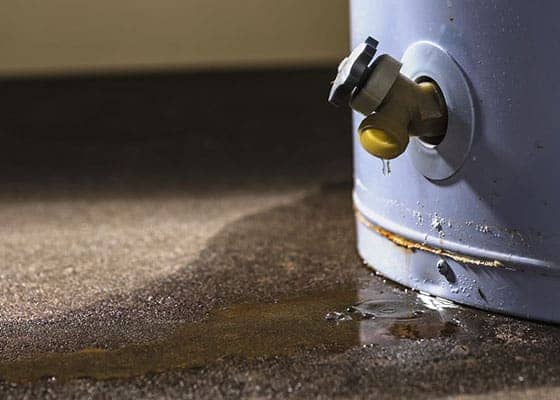 leaking water from a faucet attached to a tank