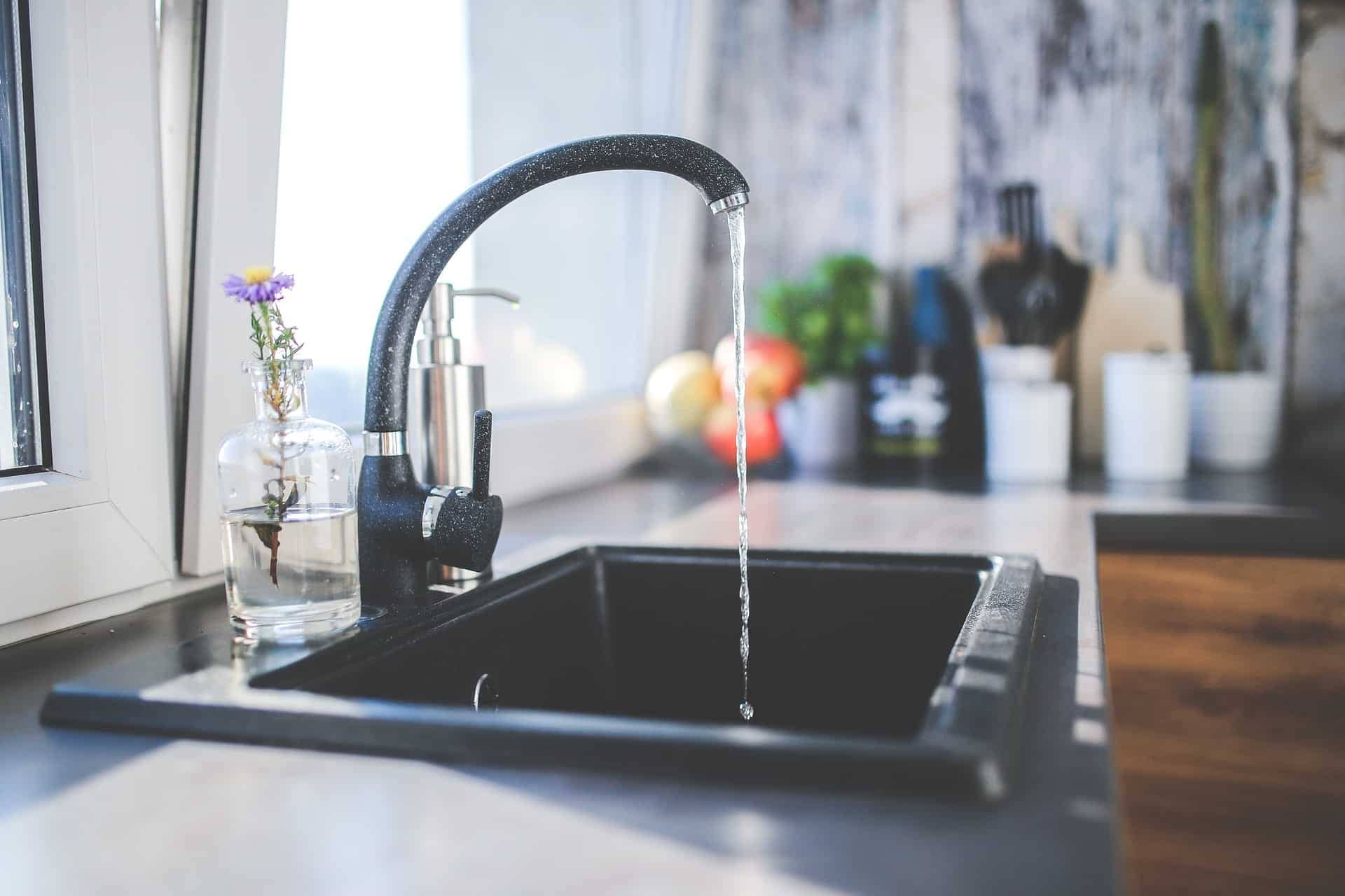 A new black kitchen sink fixture in Aurora, CO