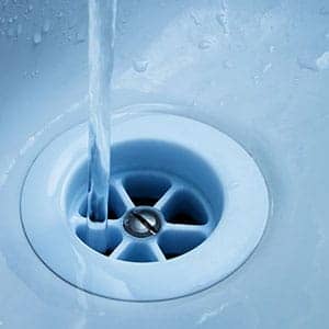 water falling to a sink drain